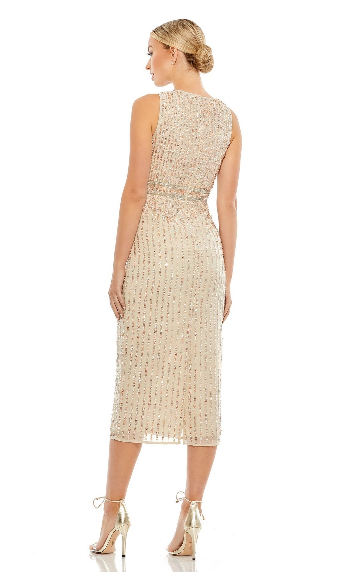 A woman faces away, wearing the Mac Duggal 70267 Beaded Midi Wedding-Guest Dress with gold heels. Her hair is in a low bun, and the background is plain white.